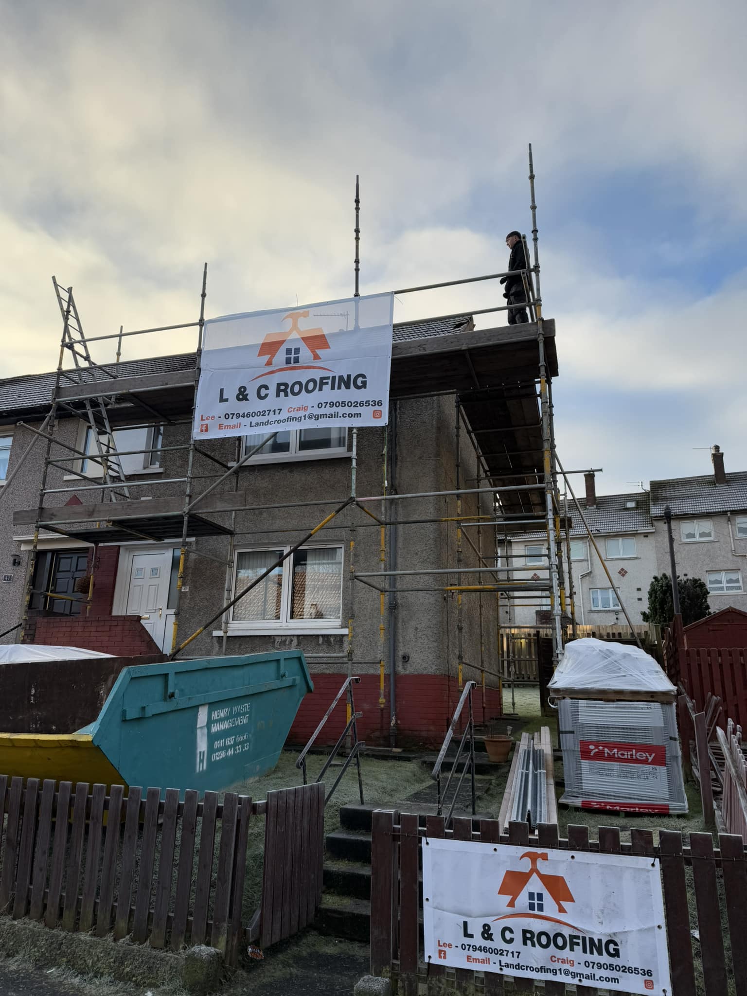 L & C Roofing working on a job